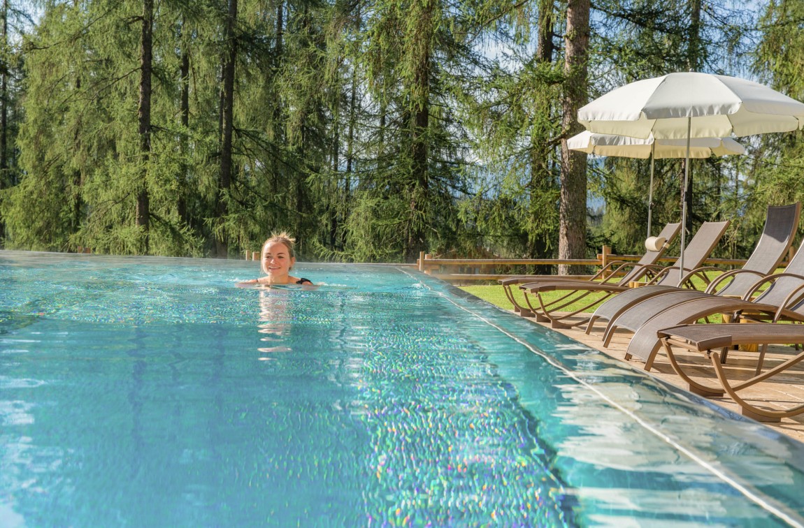 Woman swimming in the pool at Hotel Lindenhof